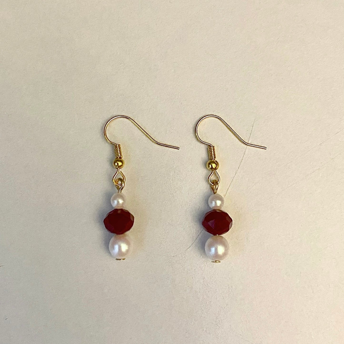 red pearl earrings